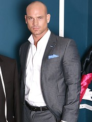 Sexual hunky boss posing before mirror