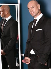 Sexual hunky boss posing before mirror