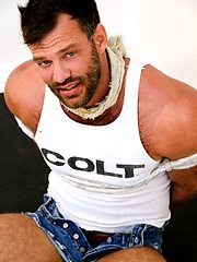 Hairy and muscle hunk Aaron Cage bound scene