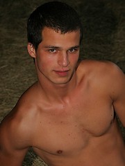 Horny naked twink posing in a barn