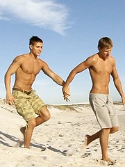 Jocks enmeshed in passionate kissing all alone on a secluded beach