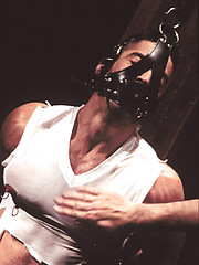 Bondaged hunk gets nipple and cock torture