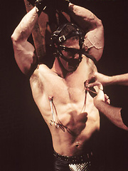 Bondaged hunk gets nipple and cock torture