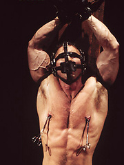 Bondaged hunk gets nipple and cock torture
