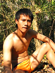 Handsome Thai guy gets naked in the wild