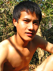 Handsome Thai guy gets naked in the wild