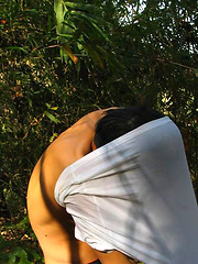Handsome Thai guy gets naked in the wild