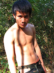 Handsome Thai guy gets naked in the wild