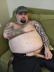 Hairy, tattooed love-stud Rowdy Hixxx strips to show you his furry belly and uncut cock