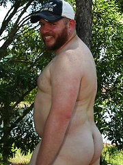 Ginger cub Sid Morgan strips naked outdoors to show off his chubby cock