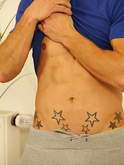 Tattooed stud Ryu Optys strokes his uncut cock.